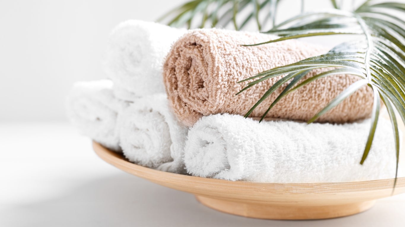 White and beige soft rolled cotton towels